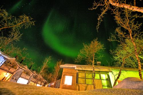 an image of the aurora dancing in the sky at Lapland Hotels Kilpis in Kilpisjärvi