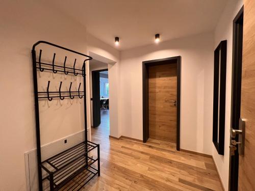 a hallway with a walkin closet in a house at NORDIC Apartamente Păltiniș in Păltiniş