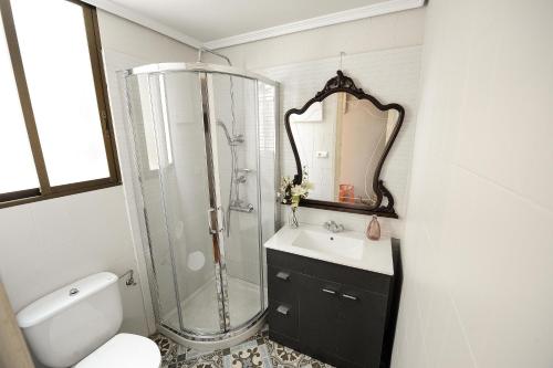 a bathroom with a shower and a sink and a toilet at Heart of Pamplona Apartments II in Pamplona