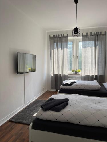 Ένα ή περισσότερα κρεβάτια σε δωμάτιο στο Ruhrpott Apartment Zentral Relax