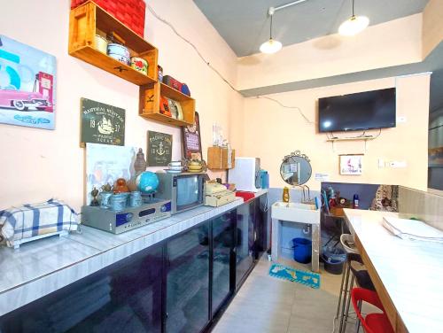 a kitchen with a counter with a fish tank on it at Pen'U Cottages by RVH in Dungun