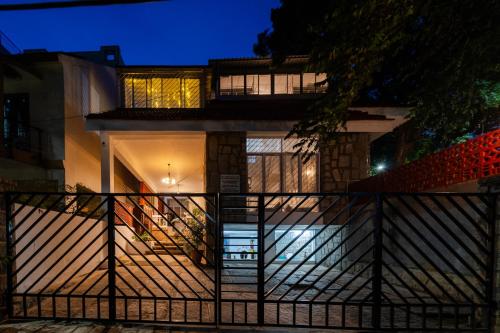 a house with a staircase in front at night at BYOC Hostels in Bangalore