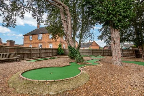 a miniature golf course in front of a house at Wychnor Park Country Club in Barton under Needwood