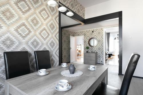 a dining room with a table with chairs and a mirror at Large Apartment next to Main Station - 85 m2 in Krakow