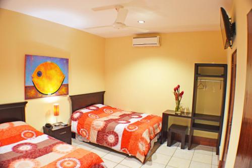 Katil atau katil-katil dalam bilik di Hotel Plaza Cosiguina