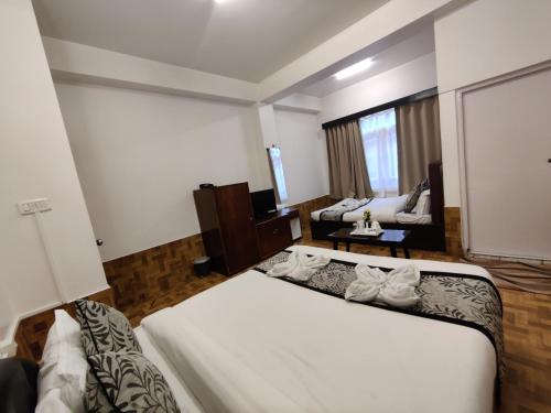 Katil atau katil-katil dalam bilik di Namdul Boutique