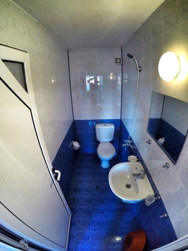 a bathroom with a toilet and a sink at Guest House Gabriel in Sozopol