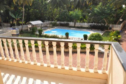 a view from the balcony of a swimming pool at Cozy Haven Luxury Holiday Home in Majorda