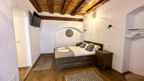 a bedroom with a bed in a room at Central garden apartments in Braşov