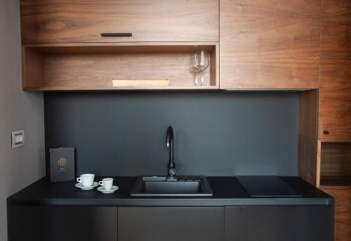 a kitchen with a sink and a counter top at H41 Luxury Suites in Belgrade