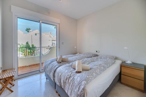 En eller flere senge i et værelse på Townhouse Sonora