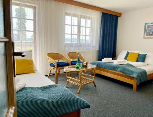 Кровать или кровати в номере Hotel Na Pláži