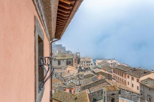 a view of a city from a window at Palazzo Catalani Resort in Soriano nel Cimino