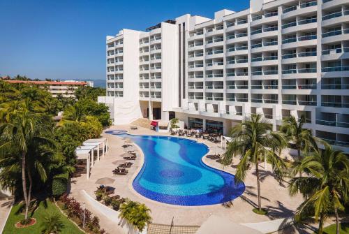 an aerial view of a hotel with a swimming pool at Wyndham Alltra Vallarta, All-Inclusive Resort in Nuevo Vallarta 