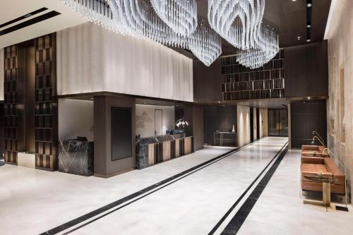 a lobby of a building with a chandelier at DoubleTree by Hilton Sanliurfa in Sanlıurfa
