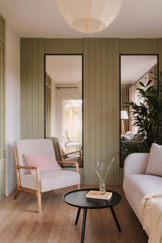 a living room with a couch and a table at Villa Saltic in Grzybowo