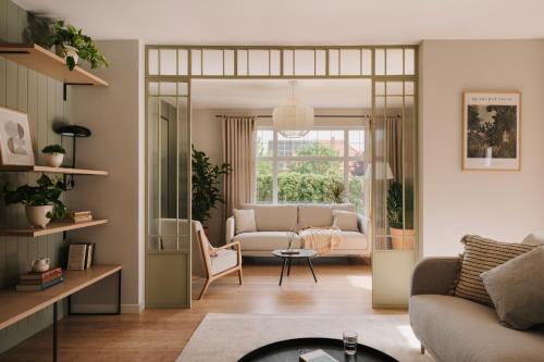 a living room with a couch and a table at Villa Saltic in Grzybowo