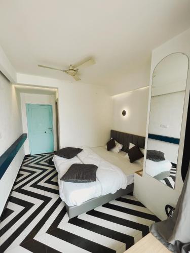 Ein Bett oder Betten in einem Zimmer der Unterkunft Joey's By The Ganges