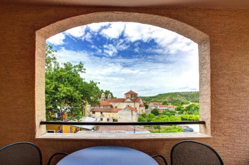 a view of a building from a window at Hotel Skradinski Buk in Skradin