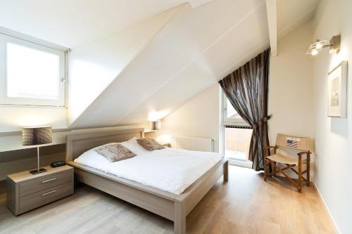 En eller flere senge i et værelse på Boathouse Suburban Amsterdam