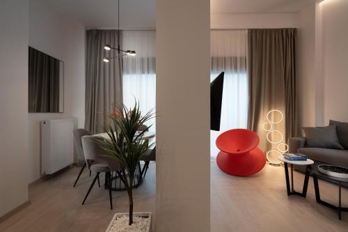 a living room with a couch and a table at The Edge - Luxury Residences in Athens