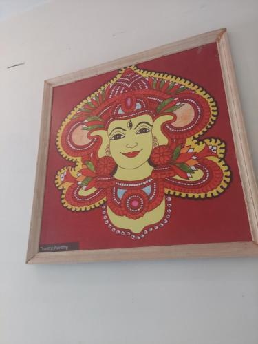 a picture of a painting of a woman at Padmatheertham Inn in Varkala
