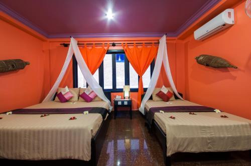 Katil atau katil-katil dalam bilik di Golden Butterfly Villa