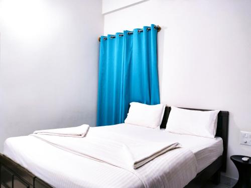 Katil atau katil-katil dalam bilik di Elegano Serviced Apartments