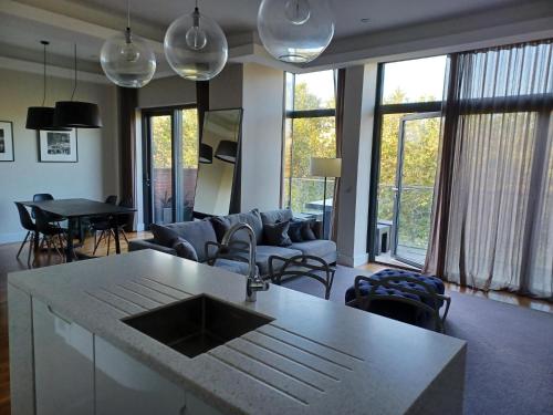 a living room with a couch and a table at Grays Inn by Aeria Apartments in London