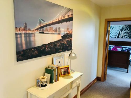 a desk with a picture of a bridge on the wall at Connemara. 3 Bedroom, 8 bed, Holiday home in Galway