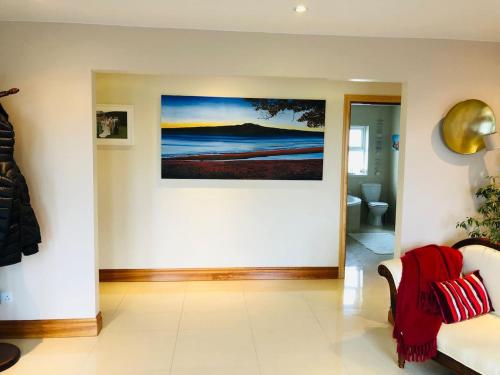 a living room with a painting on the wall at Connemara. 3 Bedroom, 8 bed, Holiday home in Galway