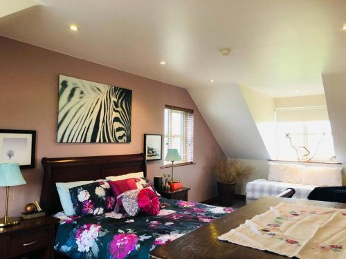 a bedroom with a bed and a painting on the wall at Connemara. 3 Bedroom, 8 bed, Holiday home in Galway