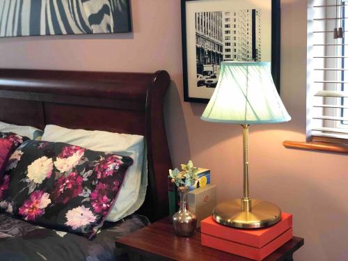a bedroom with a bed and a lamp on a table at Connemara. 3 Bedroom, 8 bed, Holiday home in Galway