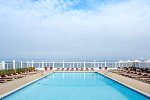 a swimming pool on the balcony of a hotel at Sound View Greenport in Greenport