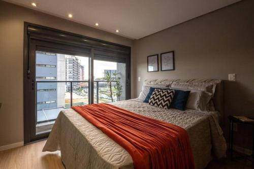 Ένα ή περισσότερα κρεβάτια σε δωμάτιο στο Inn Joy 506 no Parque Una