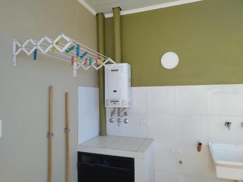 a bathroom with a sink and a towel rack at Sol Pampa in Concordia