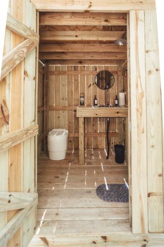 an inside view of a wooden cabin with a table at Blue Brambler Glamping A-Frame in Rockbridge
