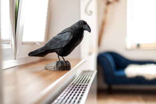 a statue of a bird sitting on a table at Ferienhof Greuthof in Bad Wurzach