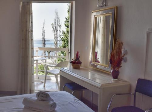 Postel nebo postele na pokoji v ubytování Hotel Theoxenia