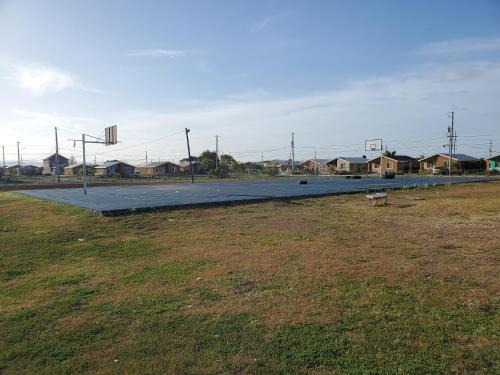 an empty parking lot with a parking lot at Beautiful 1-Bed House in New Harbour Village 3 Old Harbour St Catherine Jamaica Secured gated community in Old Harbour