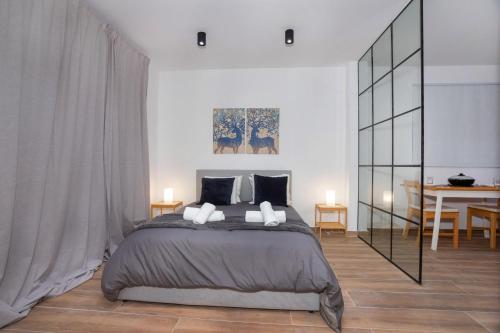 a bedroom with a large bed with two pillows at STAY Zen Studio in Limassol