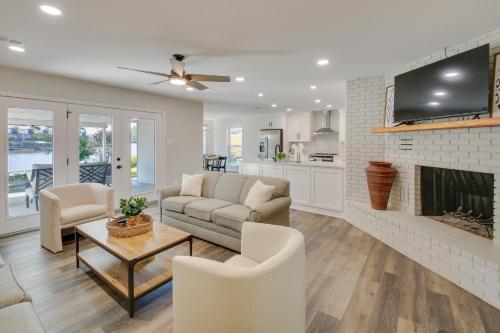 a living room with a couch and a fireplace at Waterfront Hot Springs Home with Dock and Porch! in Hot Springs