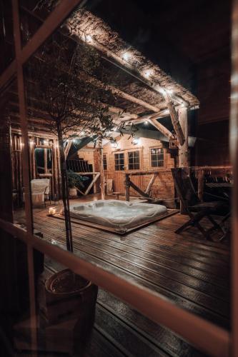 a room with a mattress on a wooden deck at Wooden Nest in Durbuy