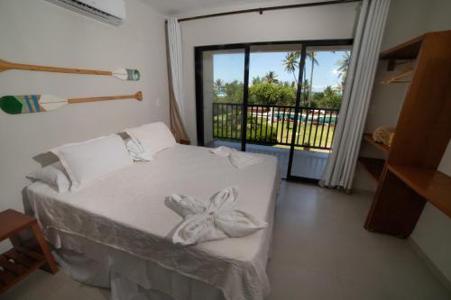 מיטה או מיטות בחדר ב-Vivant Eco Beach OFICIAL