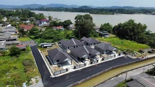 an aerial view of a house with a river at Homestay Kuala Dungun in Dungun