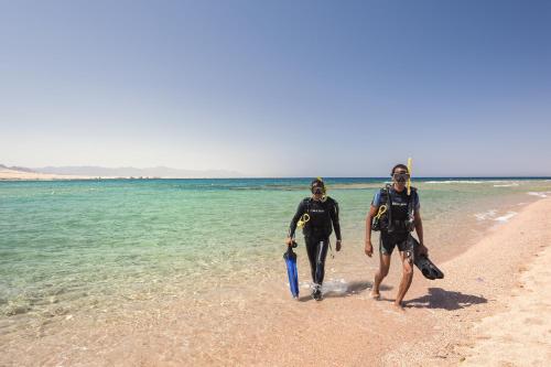 two men walking on the beach at Barceló Tiran Sharm in Sharm El Sheikh