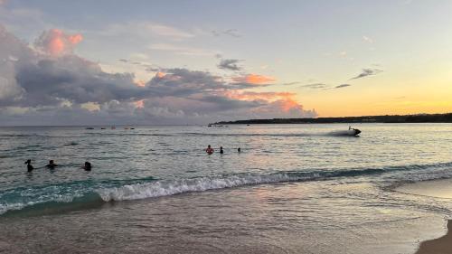 a group of people in the water at the beach at Kenting Southern Dream Resort in Kenting