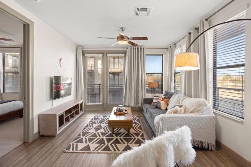 a living room with a couch and a dog at Modern Town Lake Waterfront CozySuites Paradise 07 in Tempe