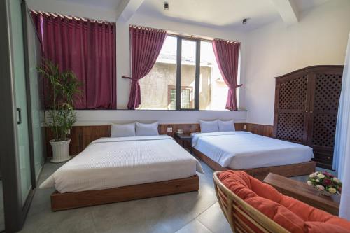 Ένα ή περισσότερα κρεβάτια σε δωμάτιο στο VILLA KIM GIA ĐÀ LẠT