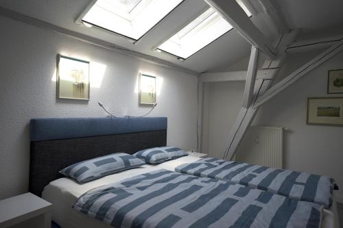 En eller flere senge i et værelse på Brauhaus Suite 20